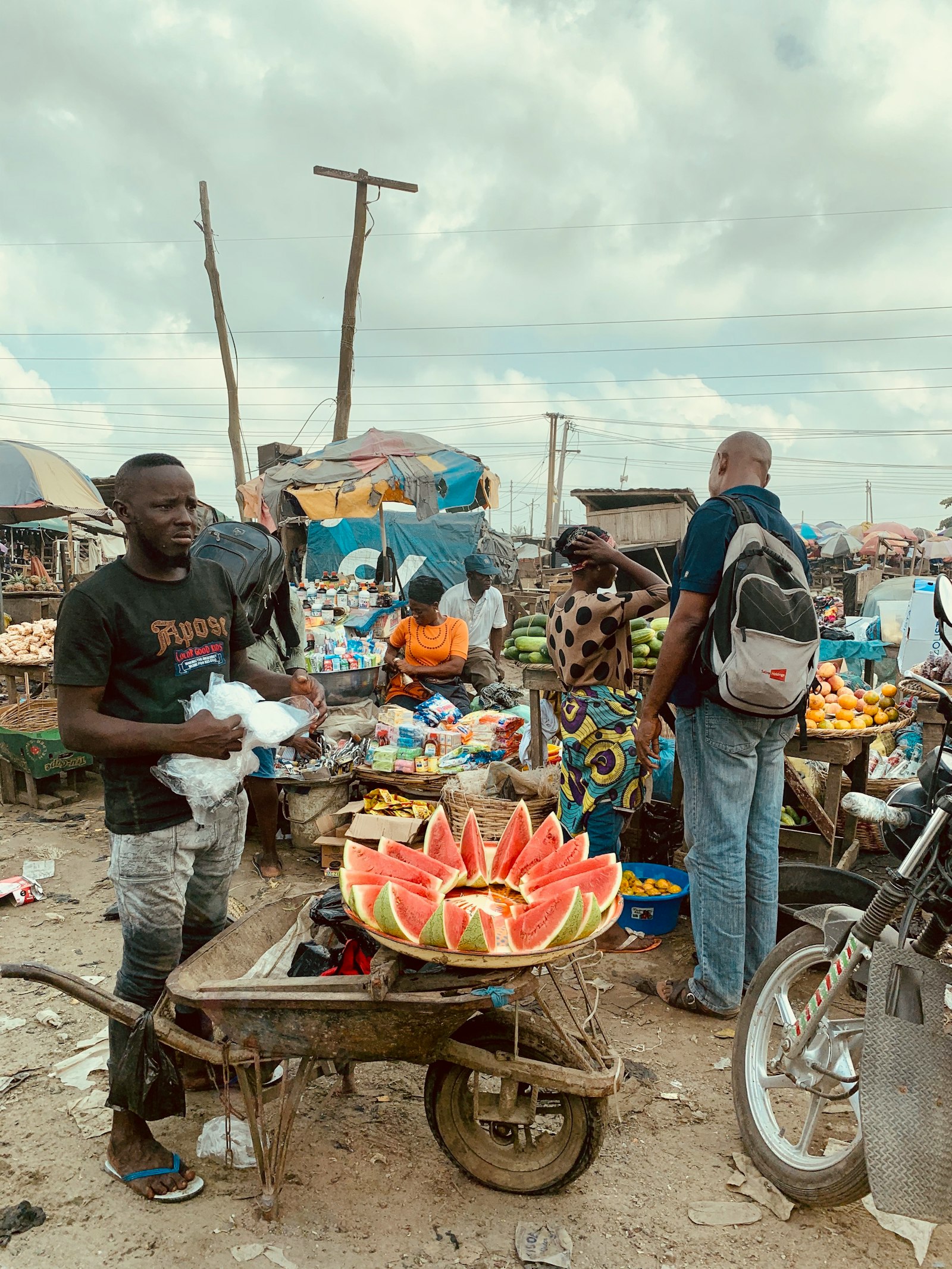 Traders selling fruit at a busy market in Lagos